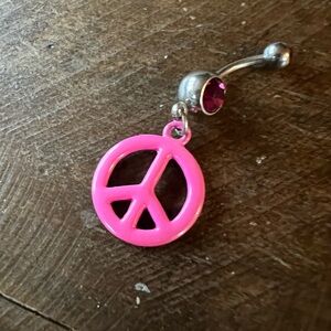 Pink peace sign belly ring